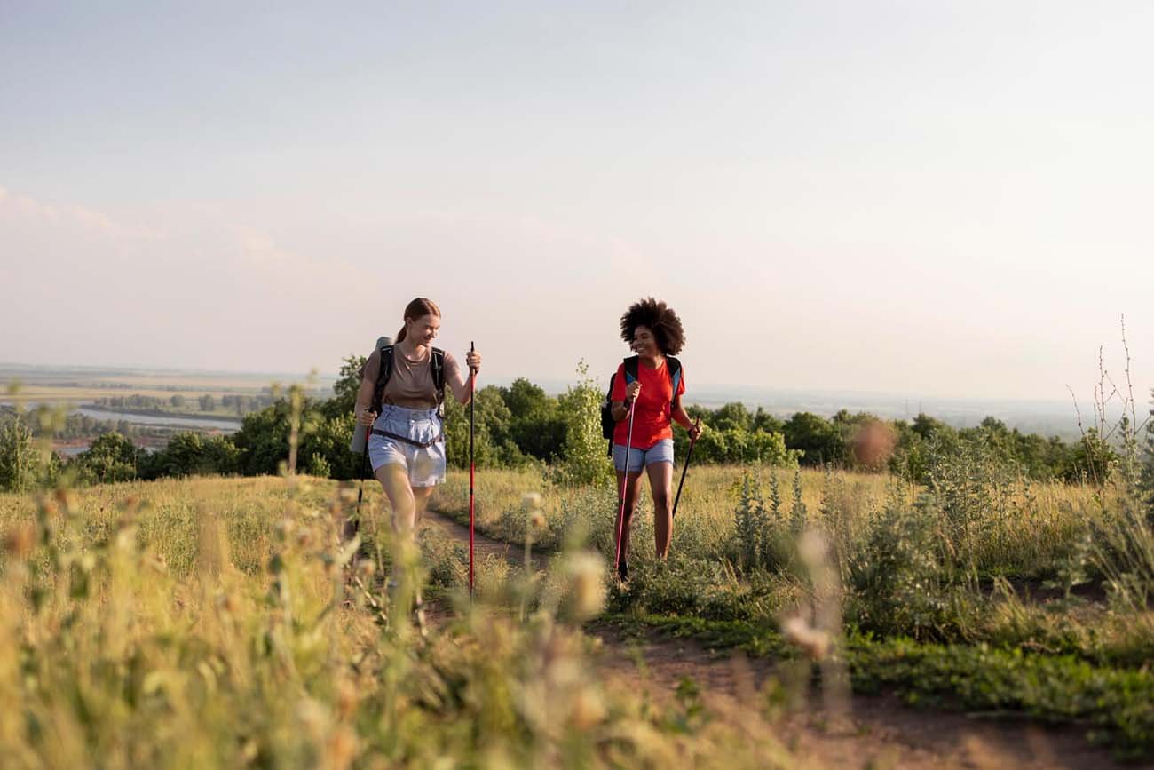 Hikers walking by the river